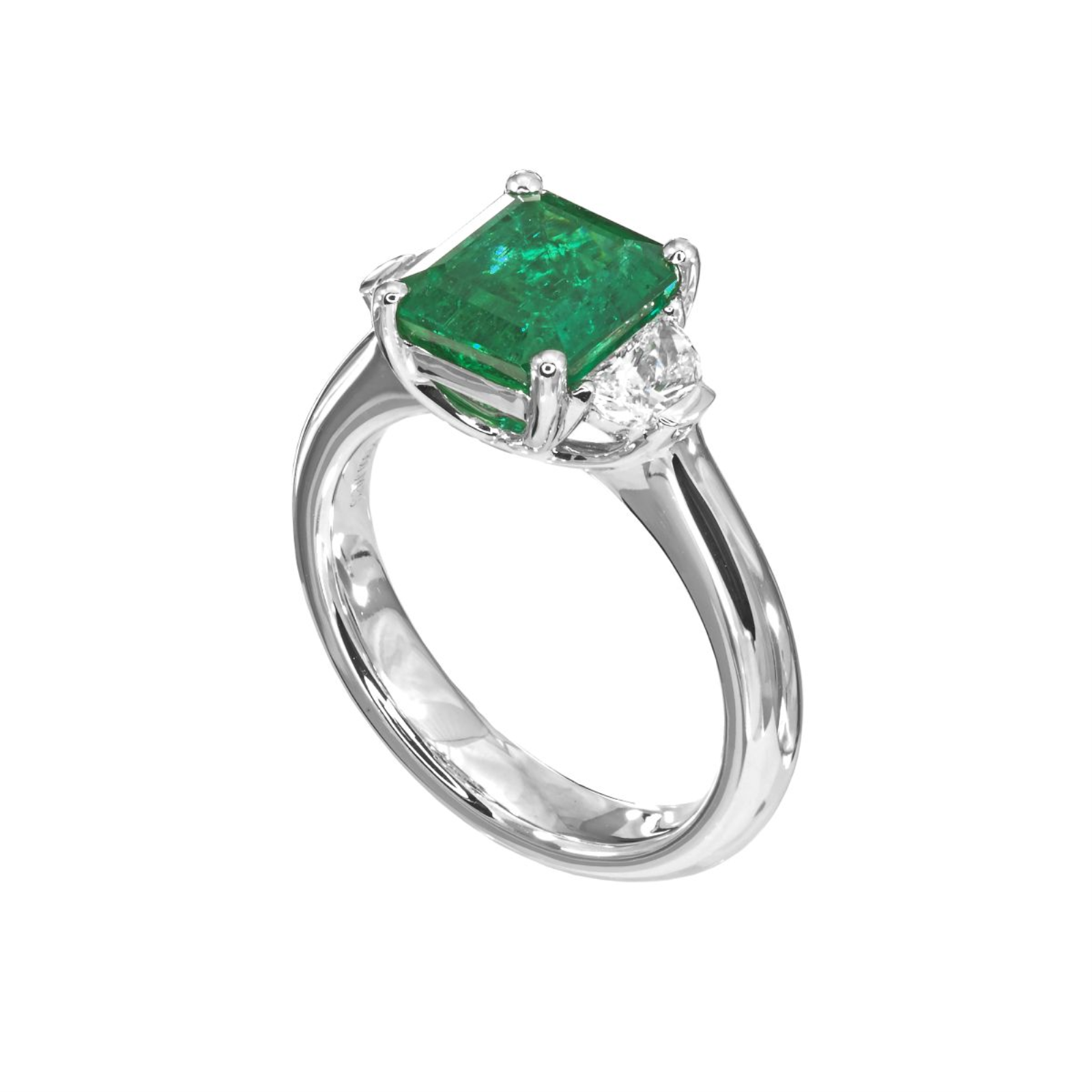 Platinum Emerald and Diamond Three Stone Ring